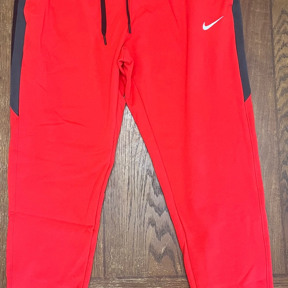Nike Women’s Red and Black Sweat Pants for Active Comfort